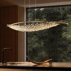 Crystal boat-shaped chandelier with gold frame and dangling clear prisms