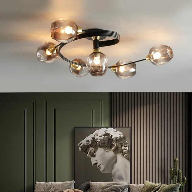 Black multi-globe ceiling light with clear glass globe shades and metal arms