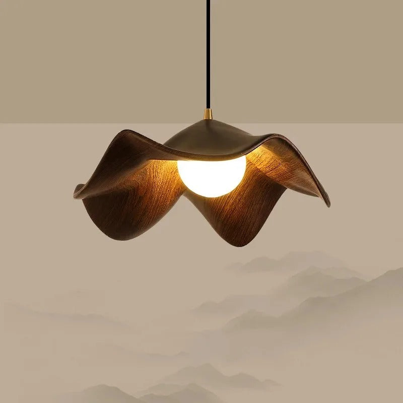 Brown curved petal pendant light with warm glowing bulb