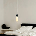 Stacked glass cylinder pendant light with dark round top, warm glow