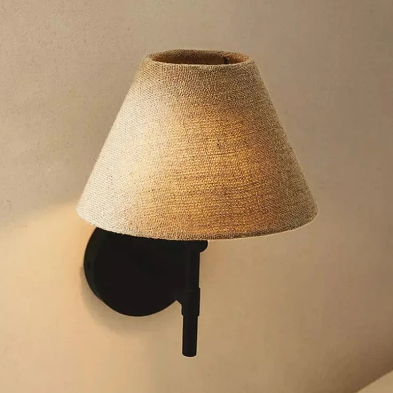 Pavo Japandi tapered cone wall light with beige fabric shade and black mount