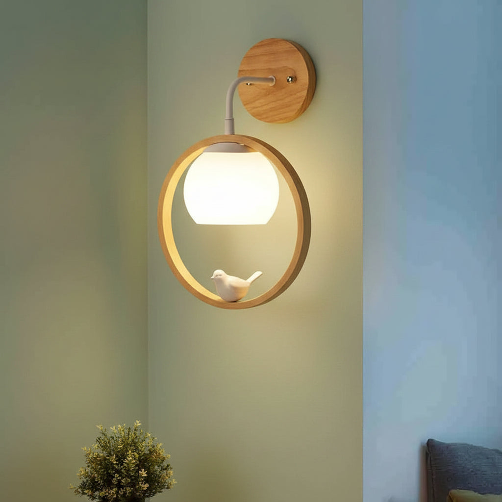 Wood halo bird wall light with glowing globe bulb and bird figure in circular ring