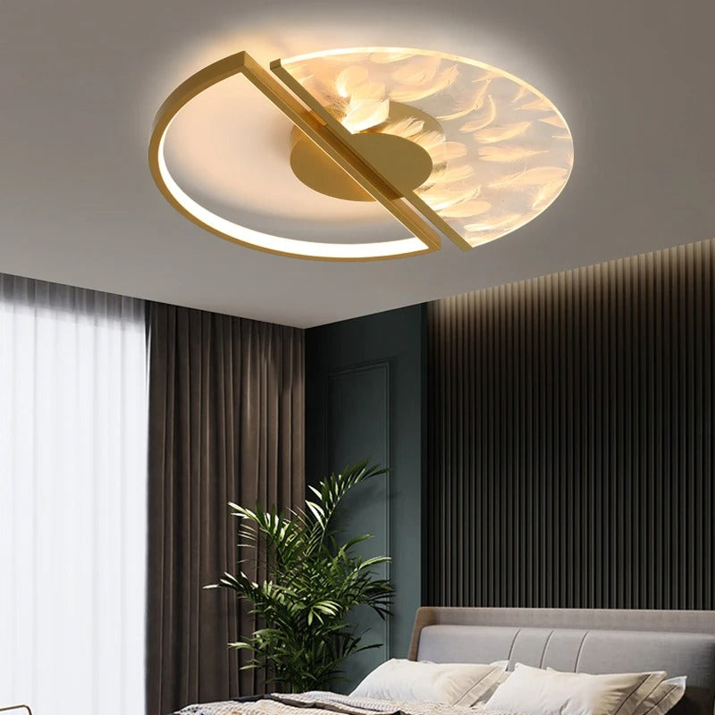Gold round split ceiling light with curved rim and central bar