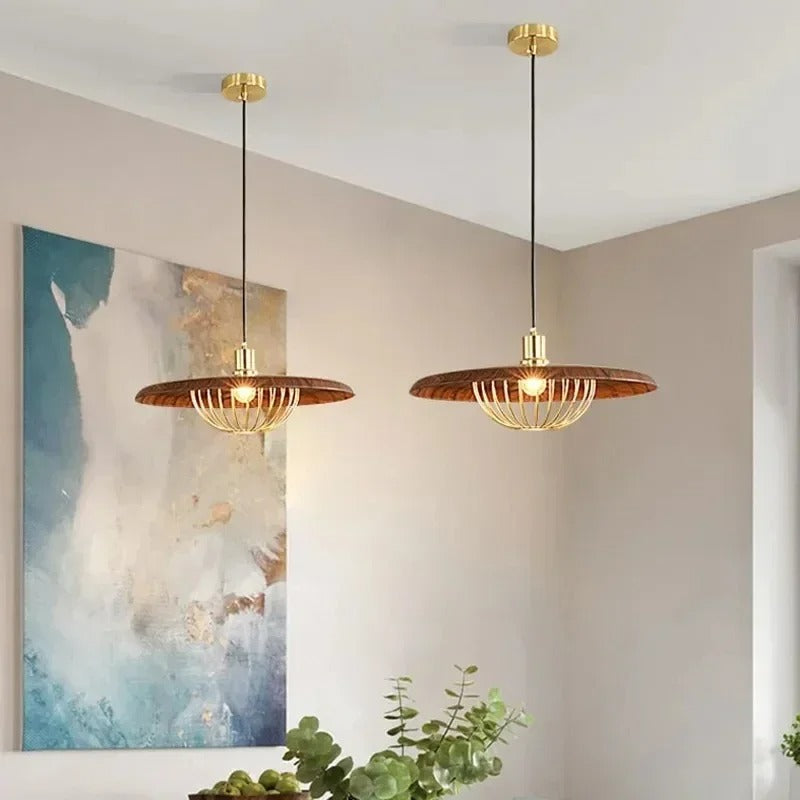 Pair of mid-century saucer pendant lights with wood disc shades and gold wire cages