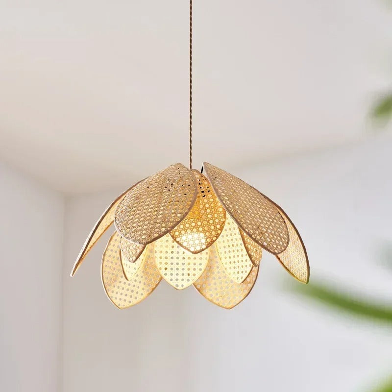 Woven rattan tiered pendant light with petal-shaped shade, warm glow