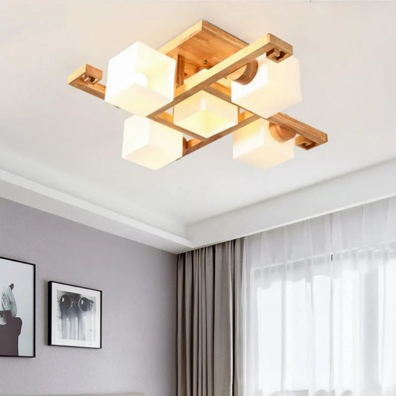 Wooden multi-head square ceiling light featuring white cube lampshades