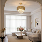 Gold ceiling chandelier with tiered hexagonal frame and hanging clear crystal drops