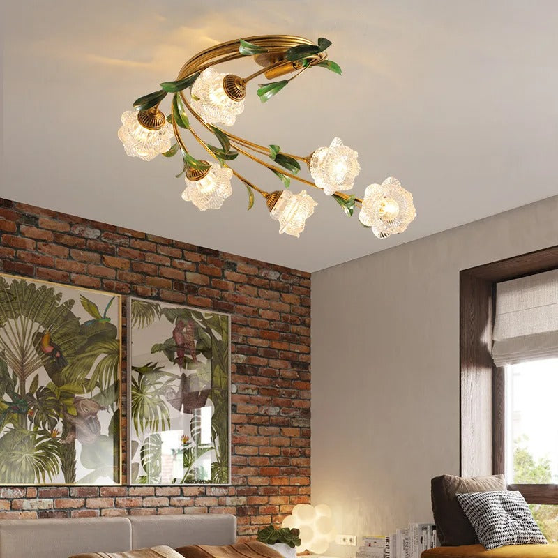 Botanical ceiling light with gold ring frame, leafy accents, and glass shade bulbs