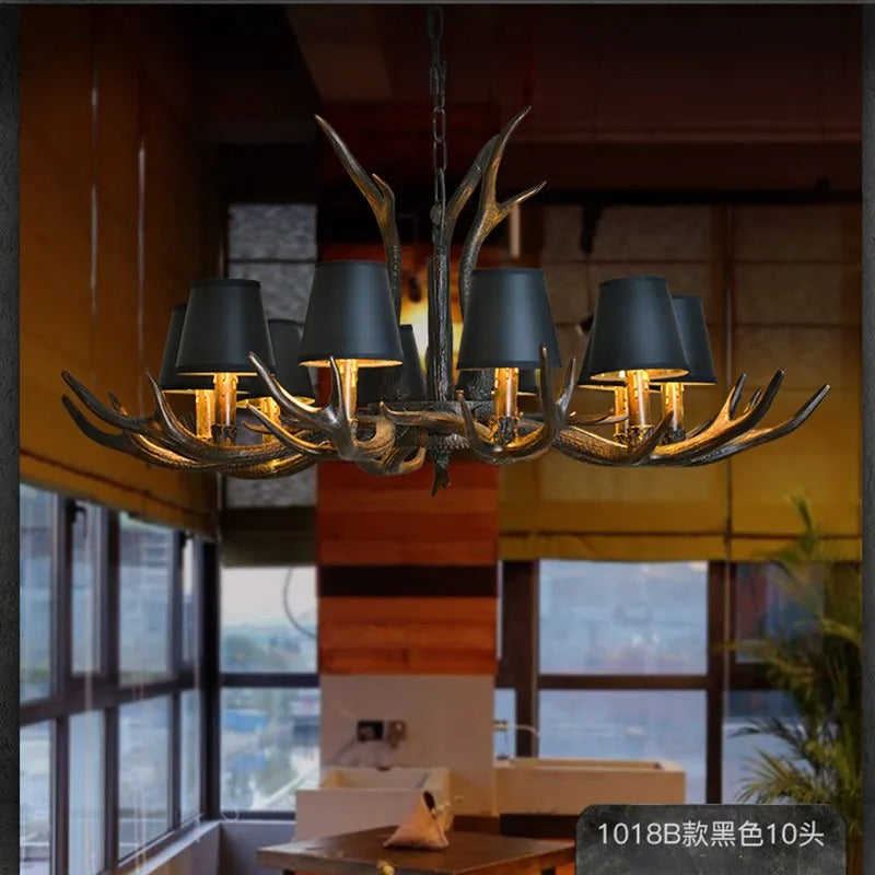 Antler bell shade chandelier with multiple dark shades and warm glowing bulbs