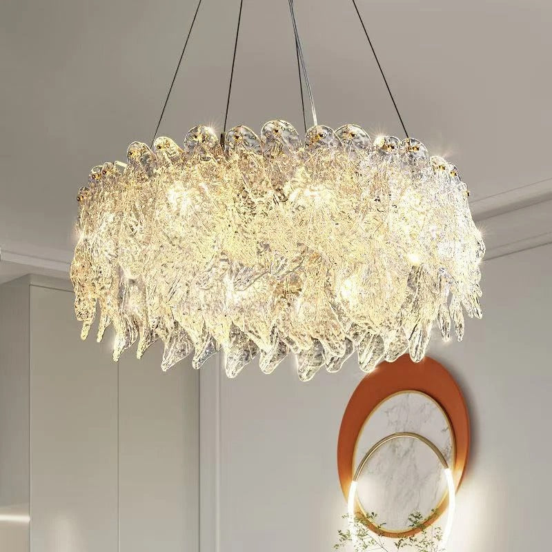 Round tiered crystal chandelier, gold-toned frame with dense hanging crystal drops
