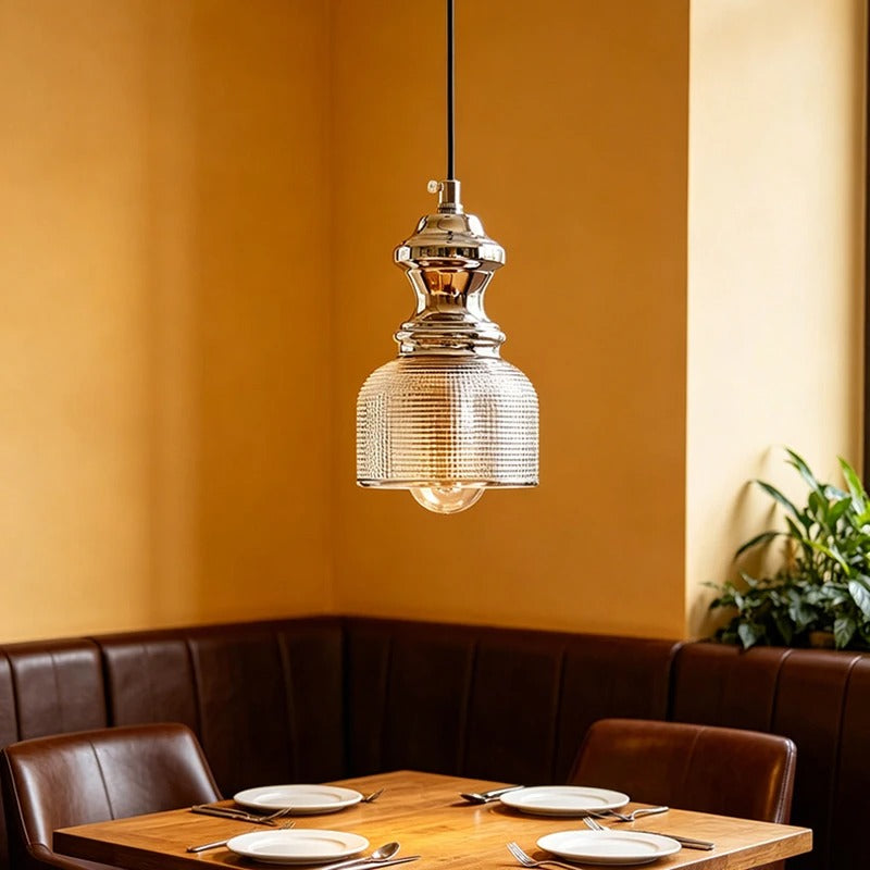 Bell-shaped glass pendant light with clear ribbed shade and chrome canopy