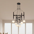 Black H-frame globe chandelier with multiple hanging glass bulbs and round ceiling canopy