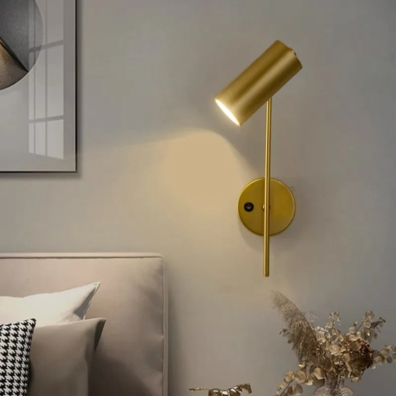 Gold swivel head wall spotlight with angled cylindrical shade