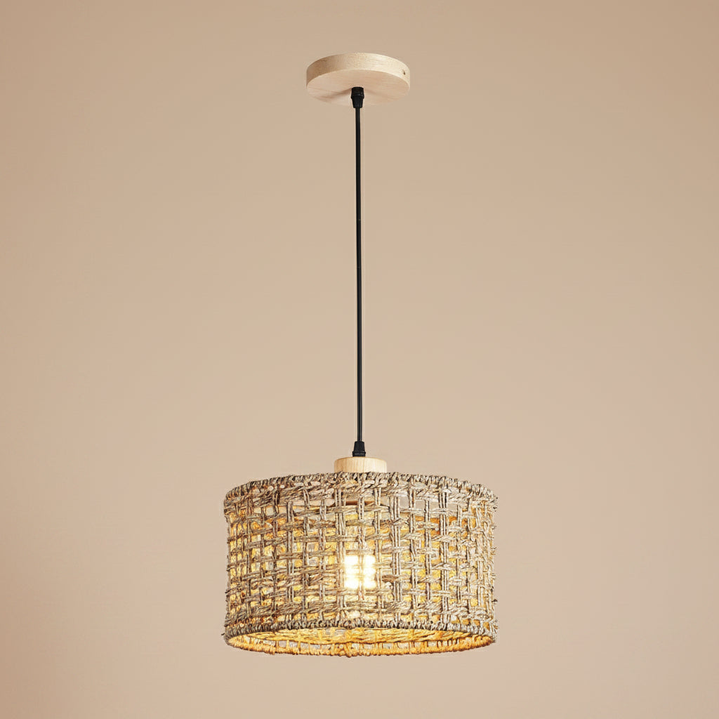 Rattan drum pendant light with woven cylindrical shade and black hanging cord