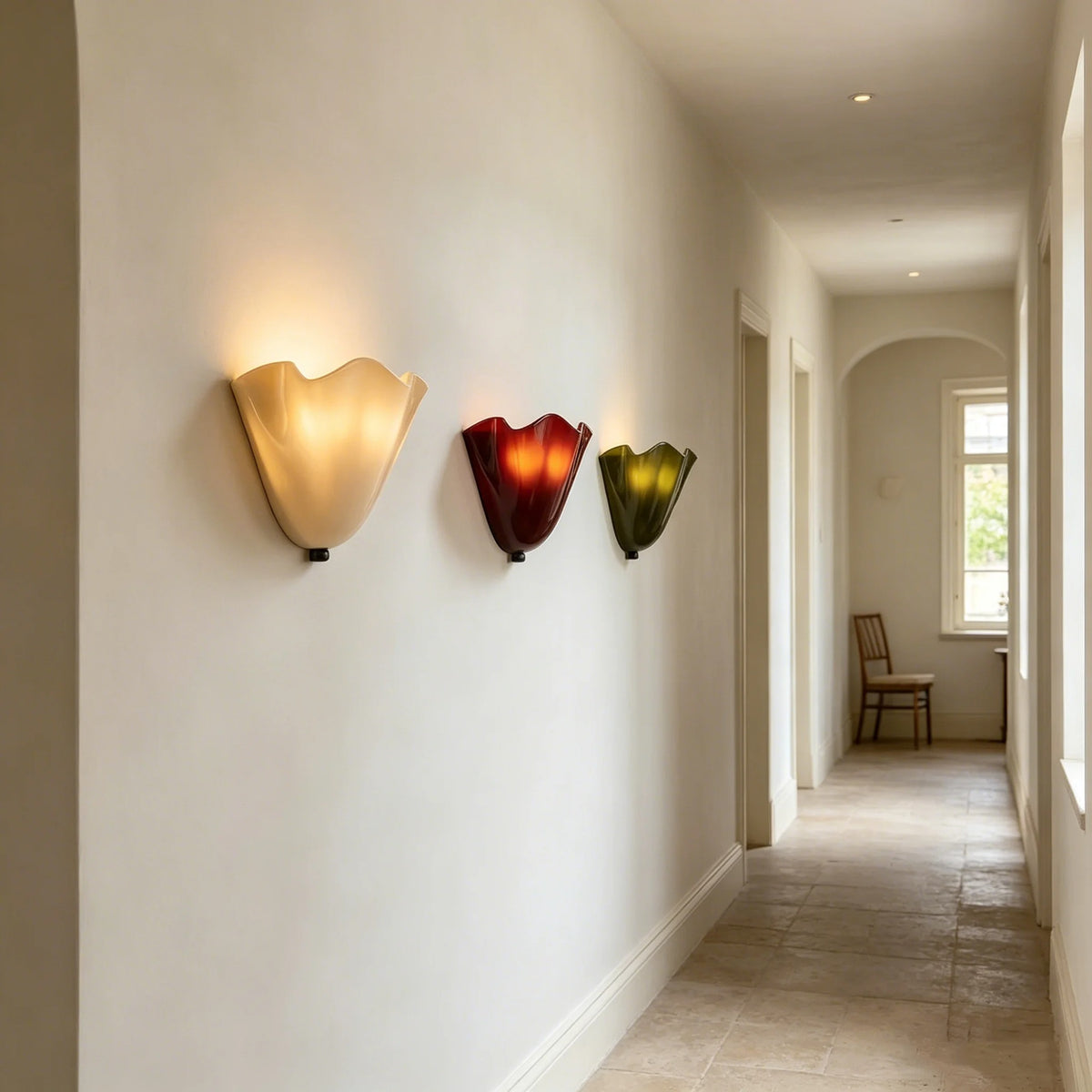 Scalloped wave glass wall lights with warm white, red, and green shades, black caps