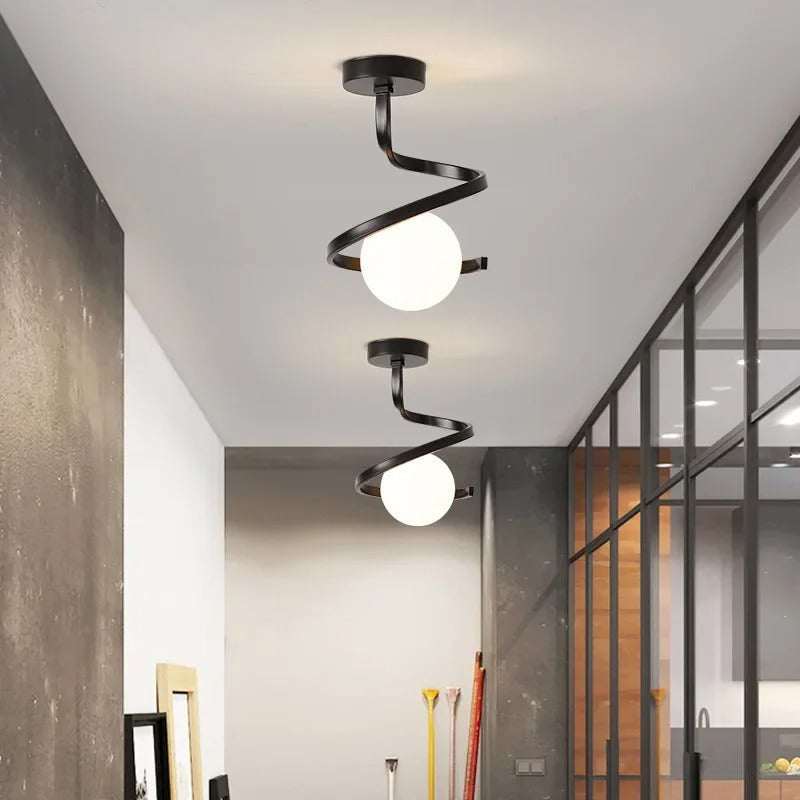 Black spiral ceiling light with two white globe shades and metal swirl arms.