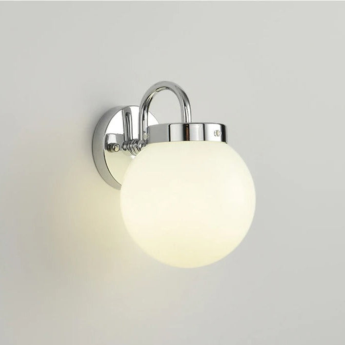 Chrome curved-arm globe wall light with round glass shade