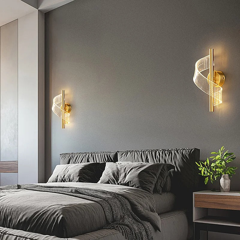 Gold twisted spiral wall light with mesh spiral shade mounted on wall