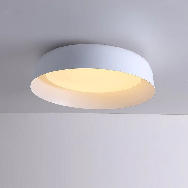 White shallow dome ceiling light with round white diffuser