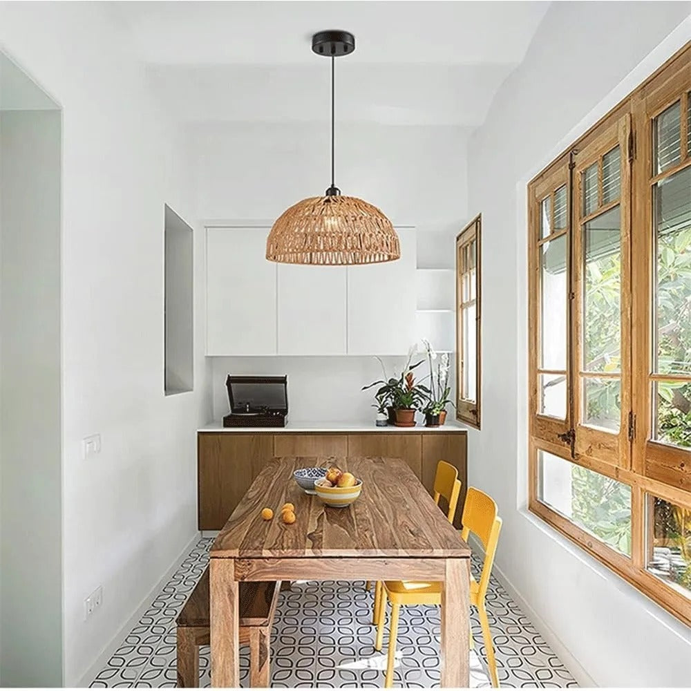 Single rope-woven trapezoid pendant light with black ceiling canopy above dining table