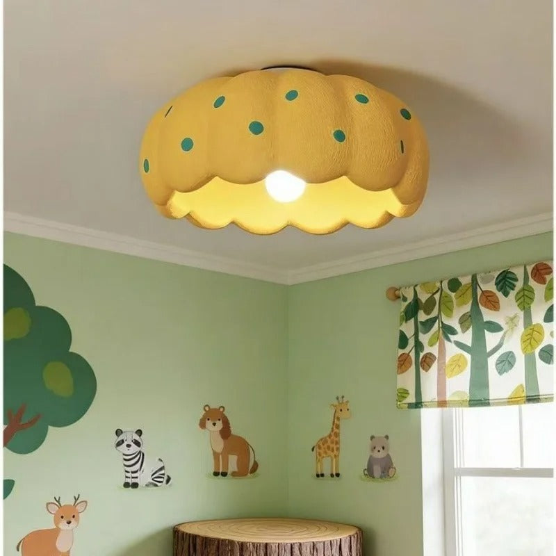 Nordic drum ceiling light: yellow scalloped shade with teal dot print and glowing bulb