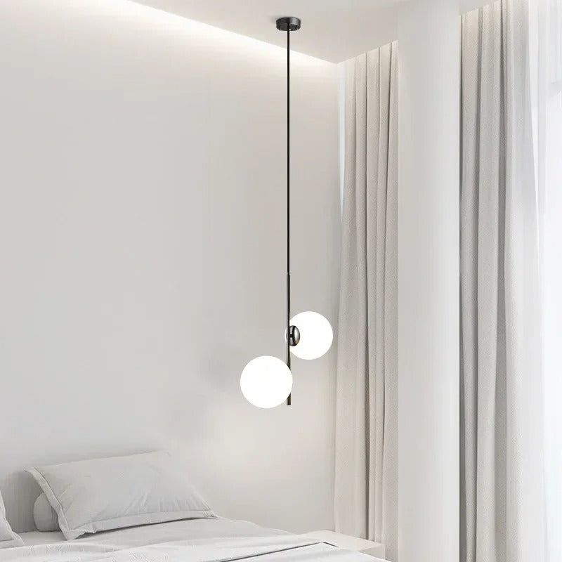 Black globe pendant light with two white glass shades