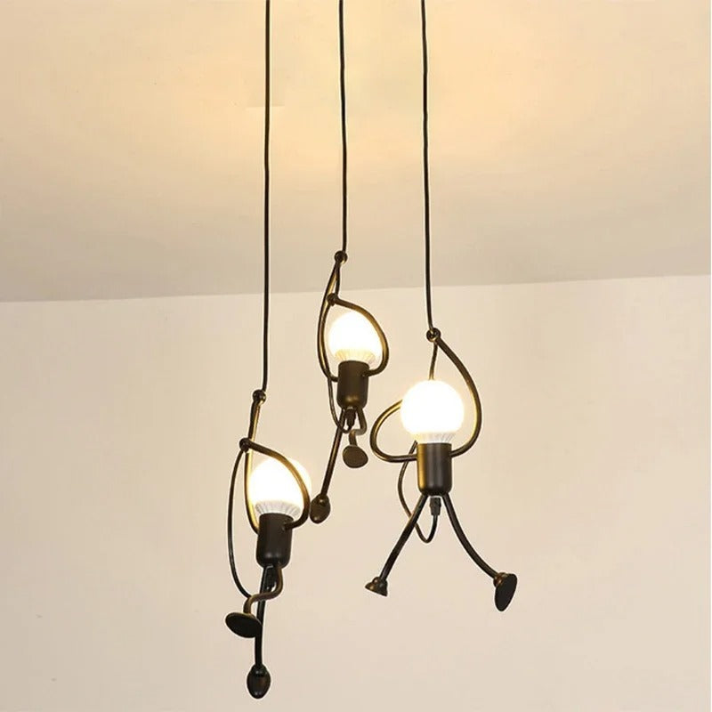 Industrial climbing man pendant light cluster with three globe shades and dangling metal limbs