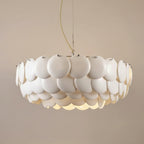 Tiered disc pendant chandelier with round white shades, hanging chain and ceiling mount