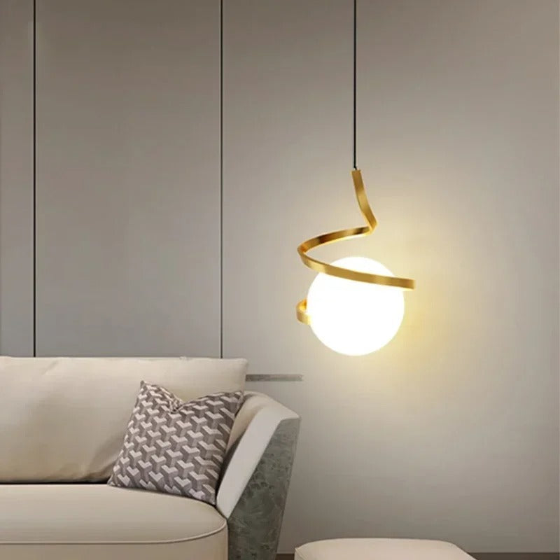 Gold spiral pendant light with white globe shade