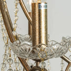 Bronze-gold candle socket with clear glass bowl and teardrop crystal accents