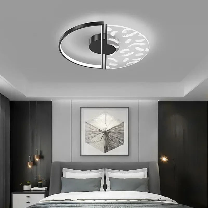 Black round split ceiling light with curved rim and central bar
