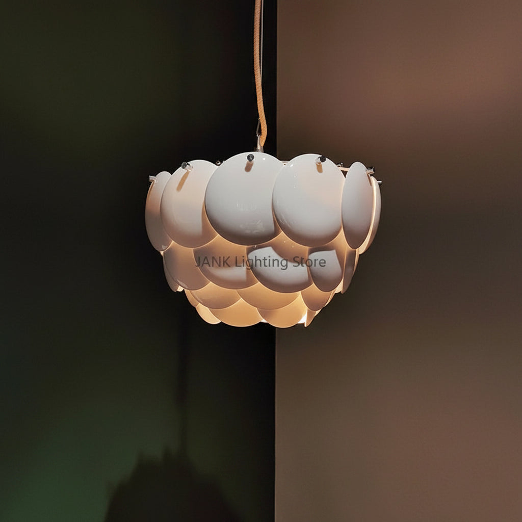 Hanging disc chandelier with white circular shades and warm light glow