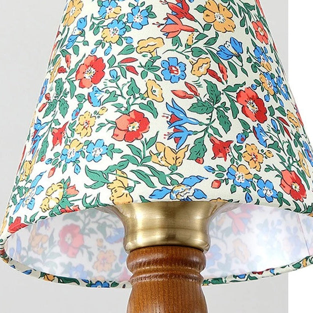 Floral fabric lampshade with gold-toned collar and scalloped trim