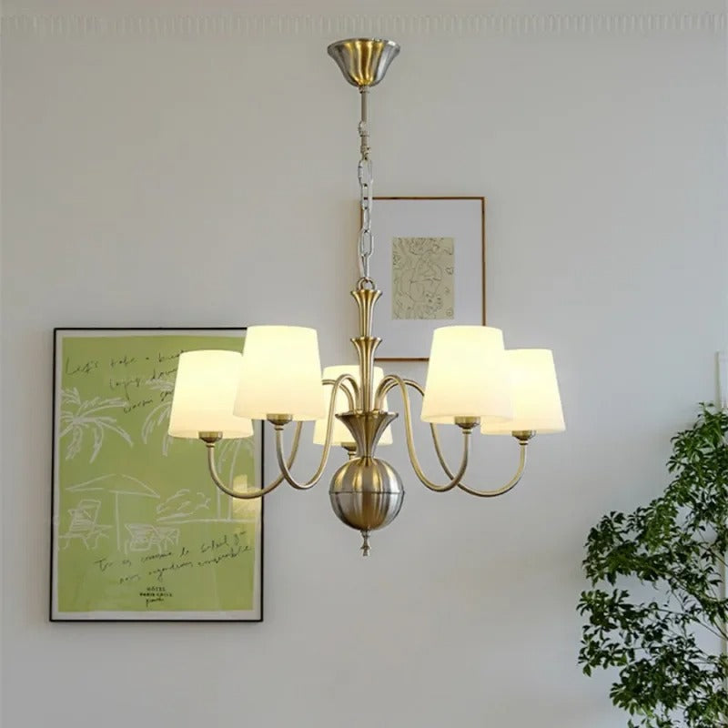 Conical multi-arm chandelier with brass finish and multiple white drum shades
