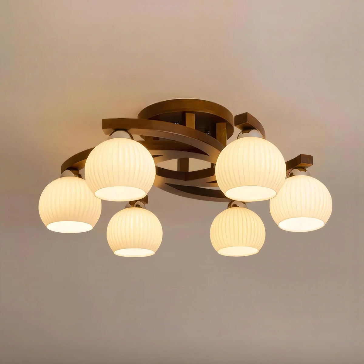 Curved ribbed globe ceiling light with 6 warm glass shades and dark brown metal frame