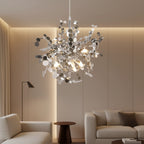 Silver branch chandelier with cascading sequin discs and glowing bulbs in a cluster