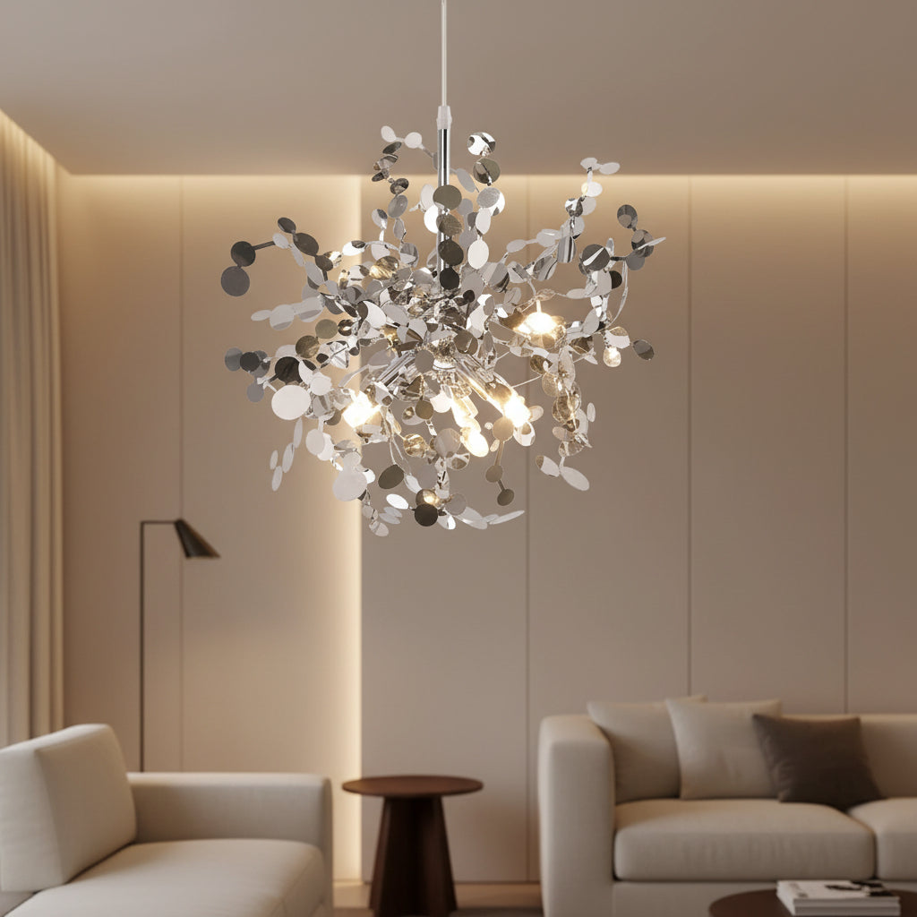 Silver branch chandelier with cascading sequin discs and glowing bulbs in a cluster
