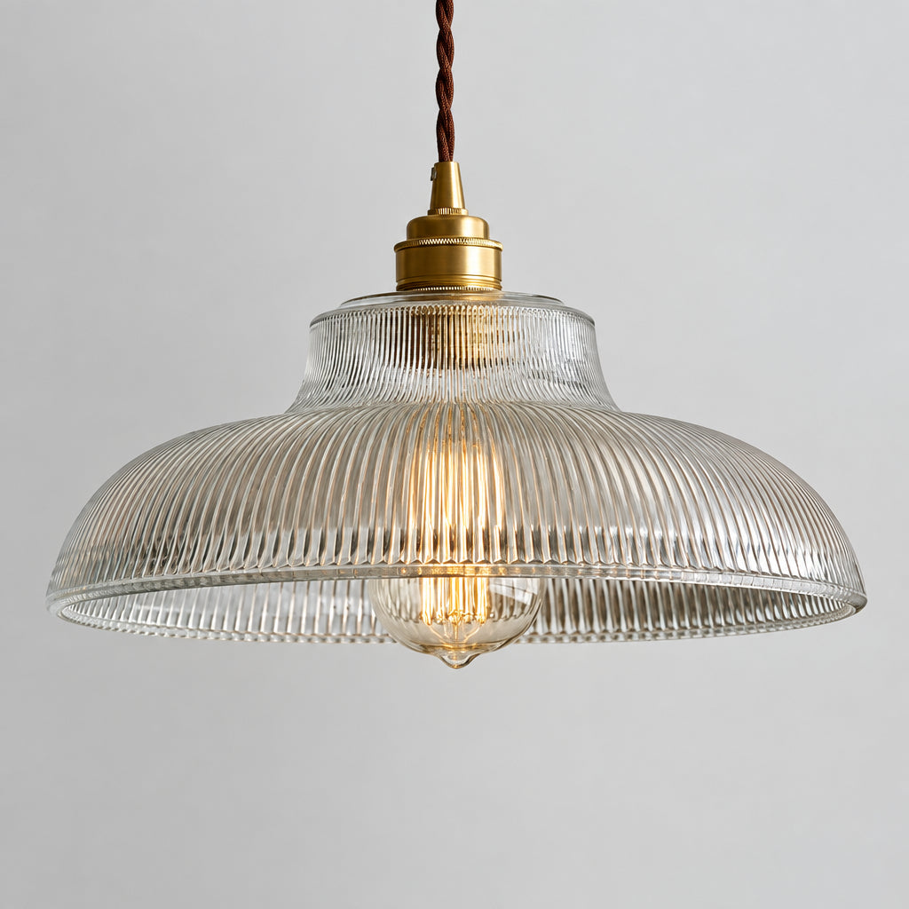 Clear ribbed glass dome pendant light with brass top and hanging cord