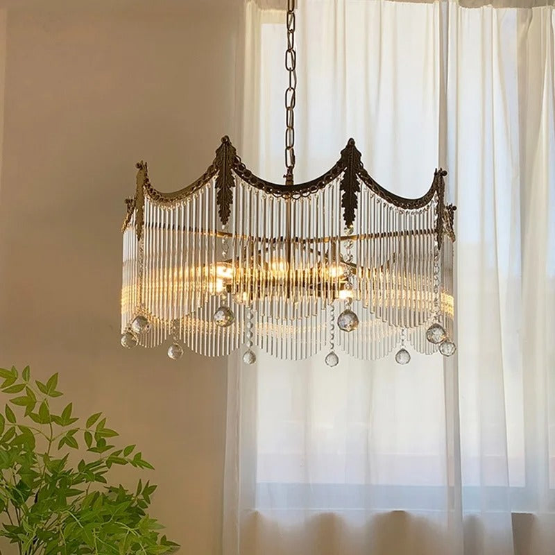Bronze tiered chandelier with cascading bead strands and hanging crystal drops on chain