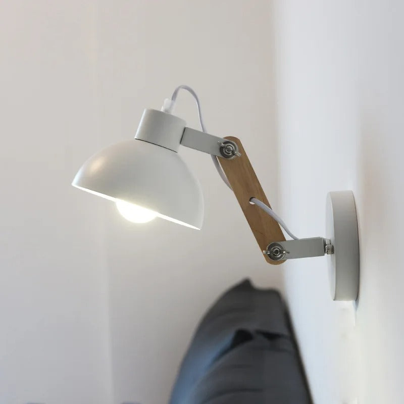 White dome swing-arm wall light with wood support and round wall mount