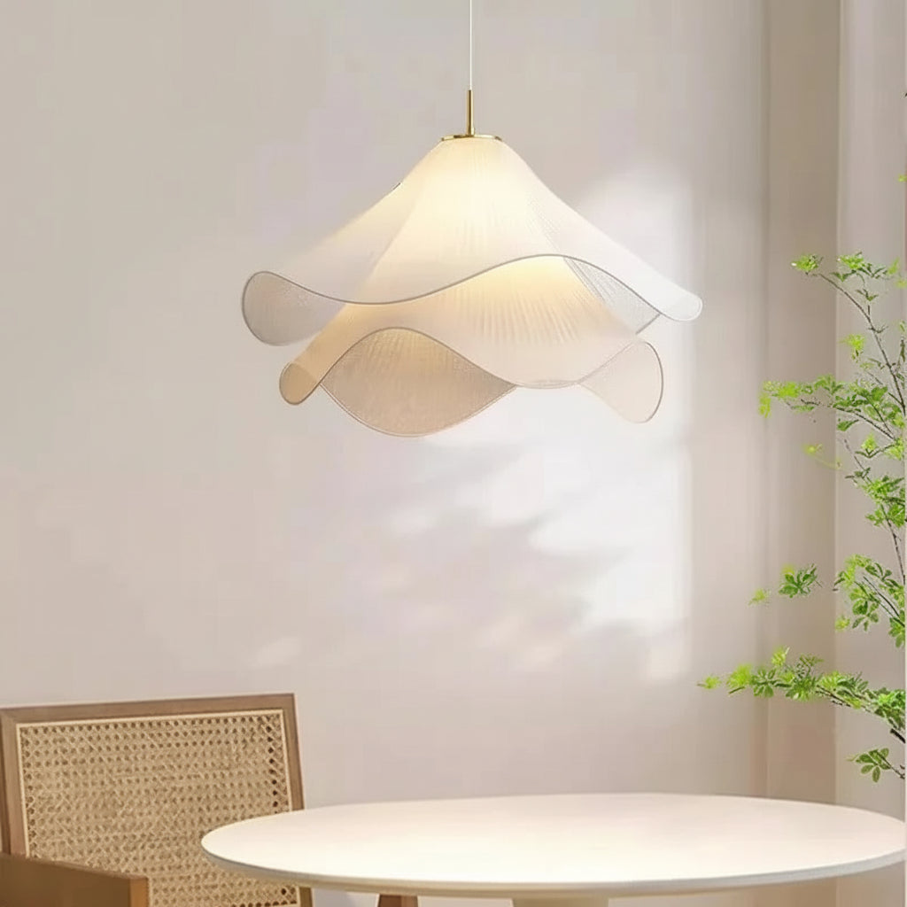 Off-white fabric flower pendant light with layered petal shade in a bright living space