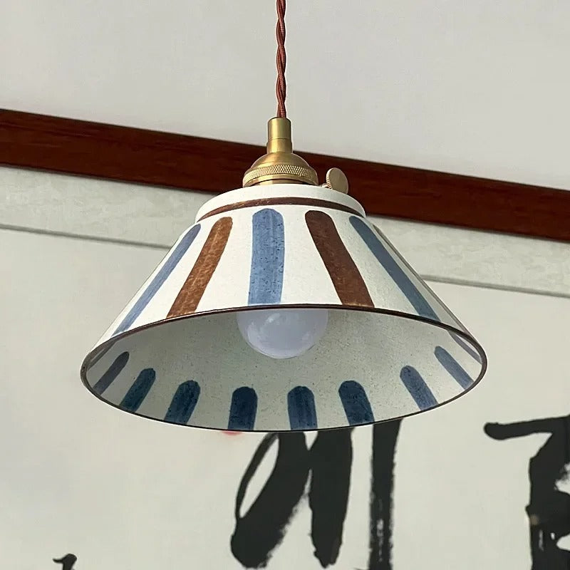 Ceramic conical pendant light with blue stripe pattern shade and twisted cord