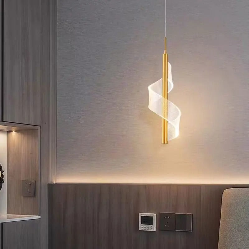 Gold spiral vertical rod pendant light with glowing bulb and translucent shade
