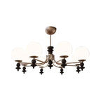 Multi-arm globe chandelier with five white globe shades and a bronze central canopy