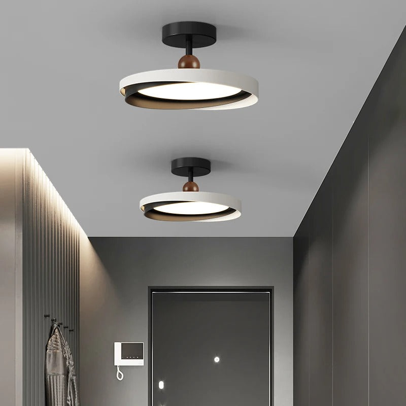 Two geometric ceiling lights with black mounts, white rings, and dark brown bead stems
