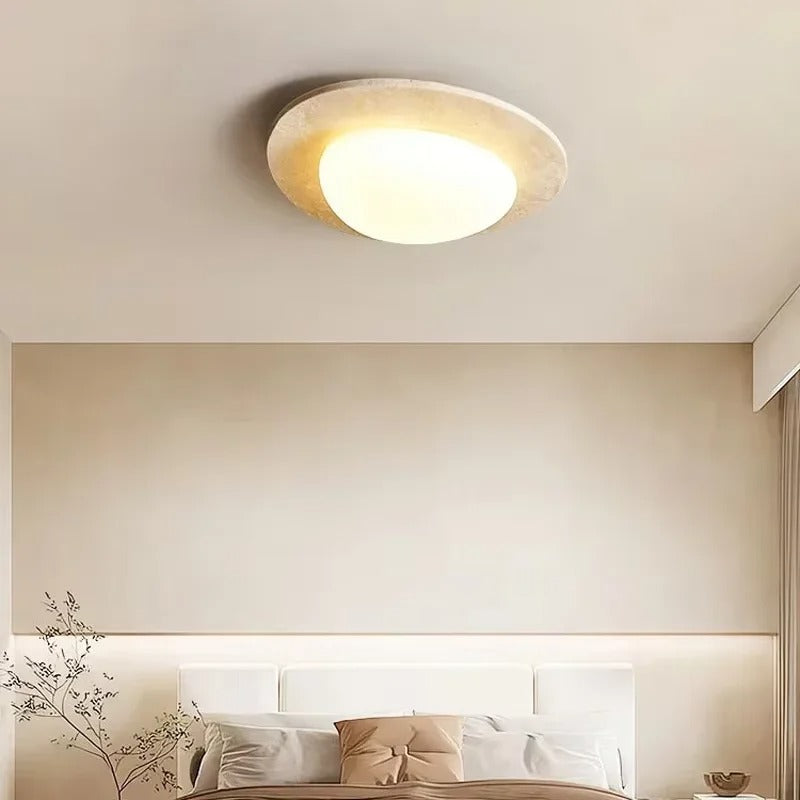 Travertine pebble-style flush ceiling light with warm white glow