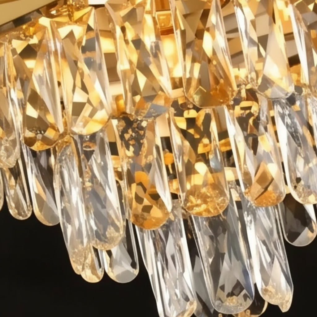 Gold tiered crystal chandelier with faceted clear teardrop prisms