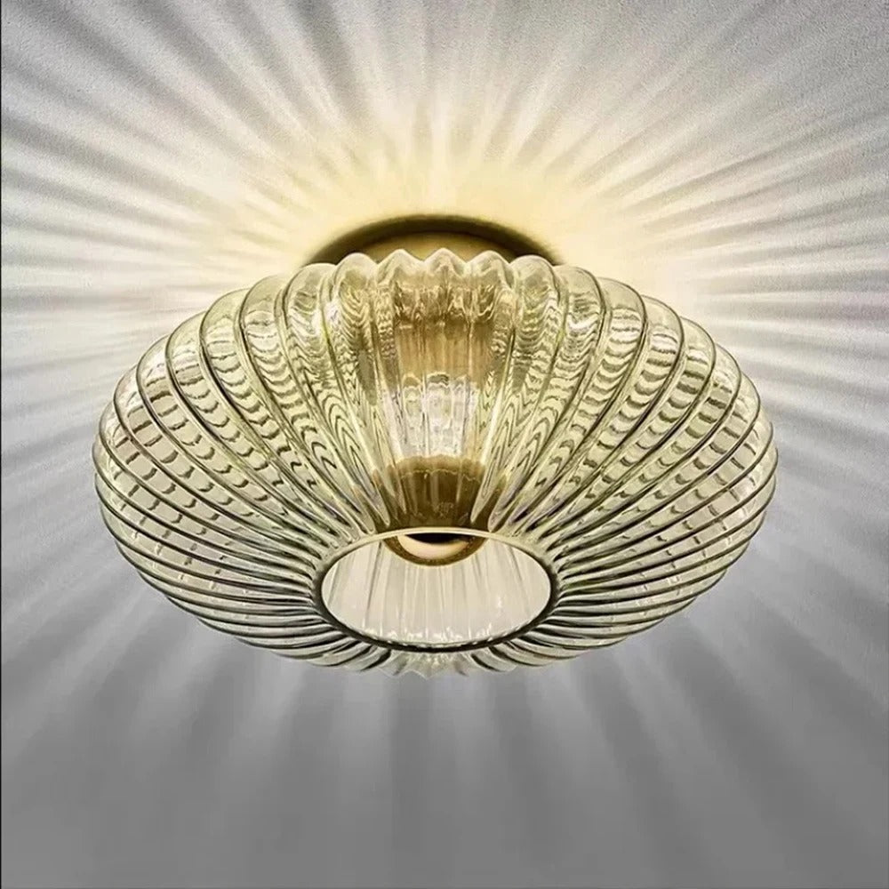 Amber fluted saucer ceiling light with ribbed glass shade and circular recessed center