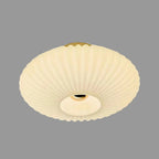 White fluted saucer ceiling light with ribbed diffuser and round recessed center