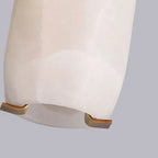 Alabaster tube pendant light bottom end with warm brass base details